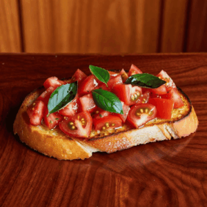 Tomato & Basil Bruschetta on toasted ciabatta with extra virgin olive oil, fresh basil & oregano.